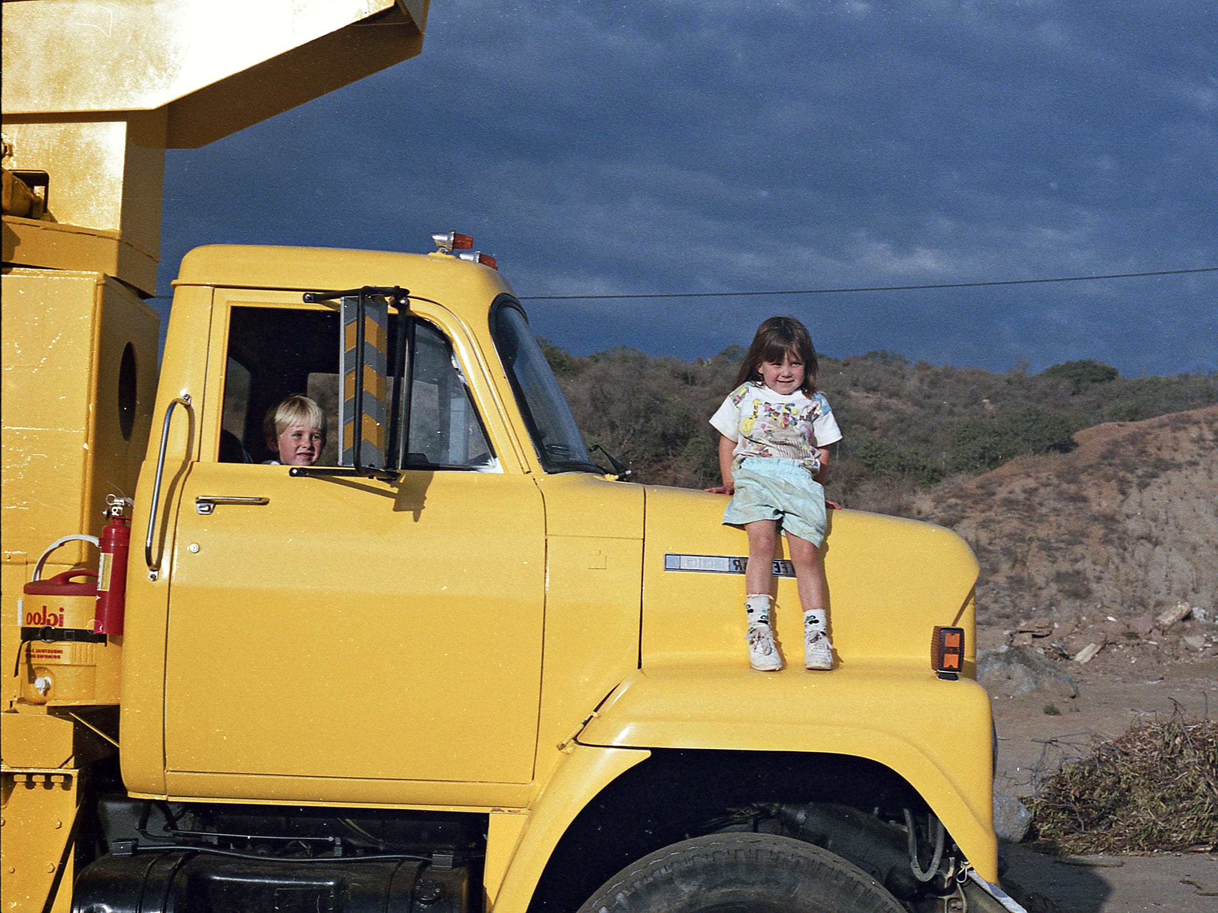 Photo of children on Large yellow truck
